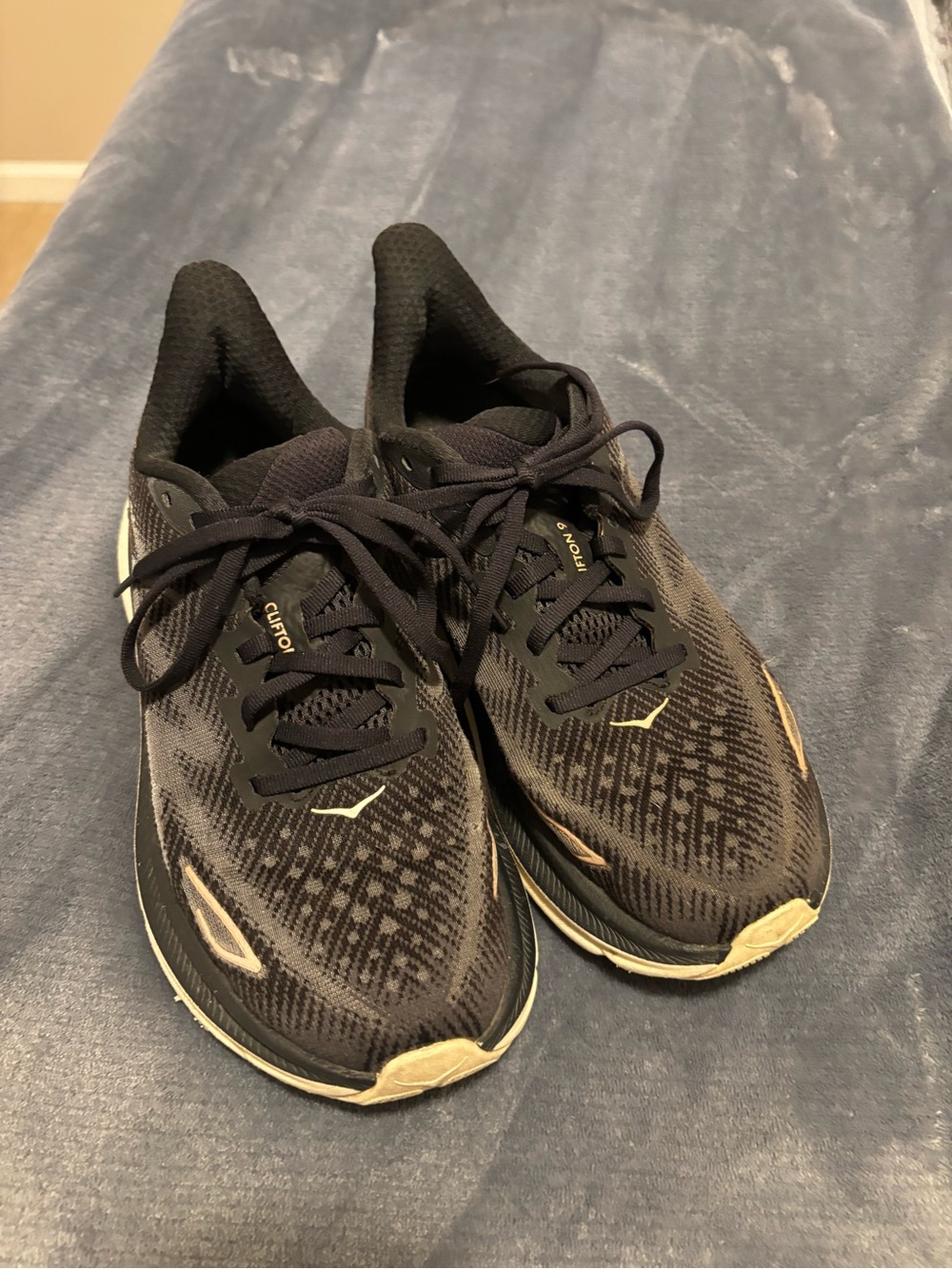 Hoka Clifton 9 Black Running Shoes with Gold Highlights